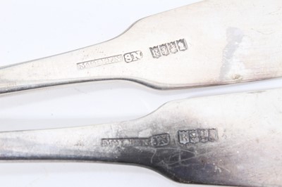 Lot 359 - Eight Georgian Irish silver fiddle pattern serving spoons of various makers and dates