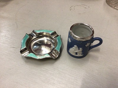 Lot 705 - Silver and enamel ashtray, together with a miniature Wedgwood silver mounted mug (2)