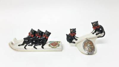 Lot 139 - Arcadian Crested China - Three Black Cats on sledge - Dawlish together with two Black Cats on seesaw (2)