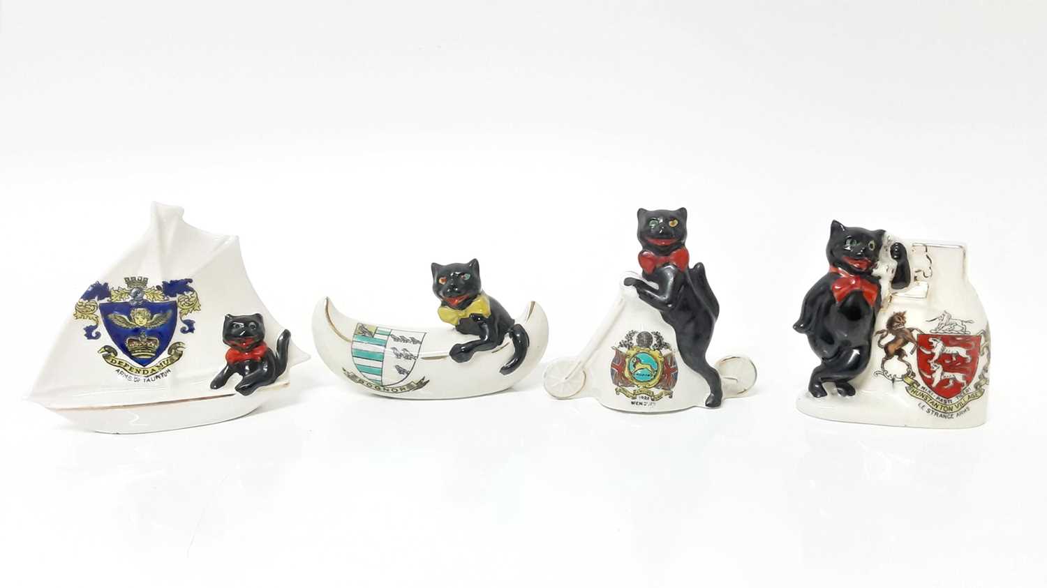 Lot 142 - Four Arcadian Crested China Black Cats - Wembley 1925, Arms of Taunton, Hunstanton Village and Bognor