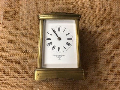 Lot 505 - Goldsmiths' & Company brass carriage clock and key