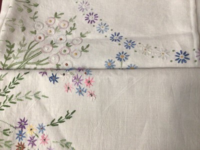 Lot 2216 - Two large early 20th century embroidered tablecloths. Similar floral designs but not a pair. 1908 stamped on each cloth.