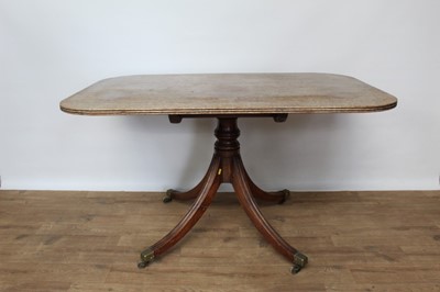 Lot 1448 - Regency mahogany breakfast table on four reeded splayed legs terminating on brass capped castors