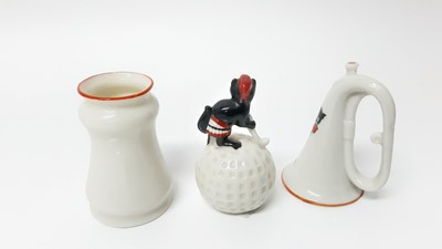 Lot 153 - Two Willow Art Crested China Black Cats - one on top of a golf ball, Broadstairs, the other in the form of a bugle, Good Luck from Edinburgh, together with Disa Art Black Cat - Good Luck from Graha...