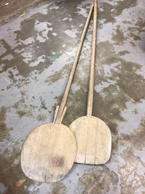 Lot 511 - Two wooden pizza oven poles