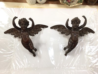 Lot 291 - Pair of 19th century carved wood winged cherubs, each 24cm across