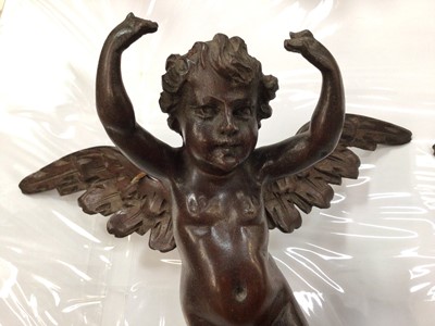 Lot 291 - Pair of 19th century carved wood winged cherubs, each 24cm across