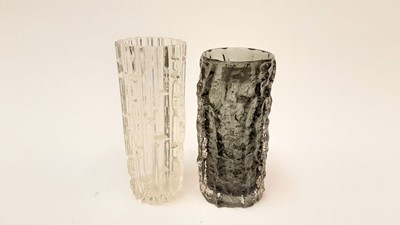 Lot 1239 - Whitefriars pewter grey bark vase designed by Geoffrey Baxter, 23cm high, together with a clear glass (possibly Swedish) glass vase (2)