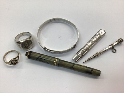 Lot 695 - Silver signet ring, Chinese ring, silver bangle, two silver pencils and Conway Stewart small fountain pen