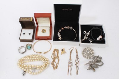 Lot 160 - 9ct gold torque bangle, Pandora silver charm bracelets, simulated pearl necklace and other costume jewellery