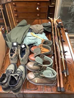 Lot 609 - Four pairs of fishing/hiking boots to include Simms, two weighted horn handles fishing sticks, a horn priest, four hiking sticks, country hats etc