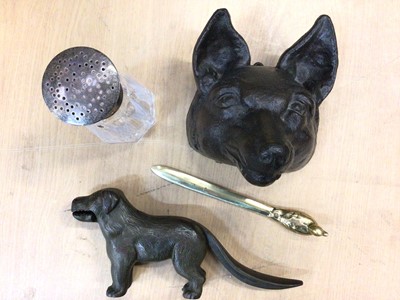 Lot 374 - Silver topped glass sugar caster, bronze fox mask, dog nut cracker and letter opener (4)