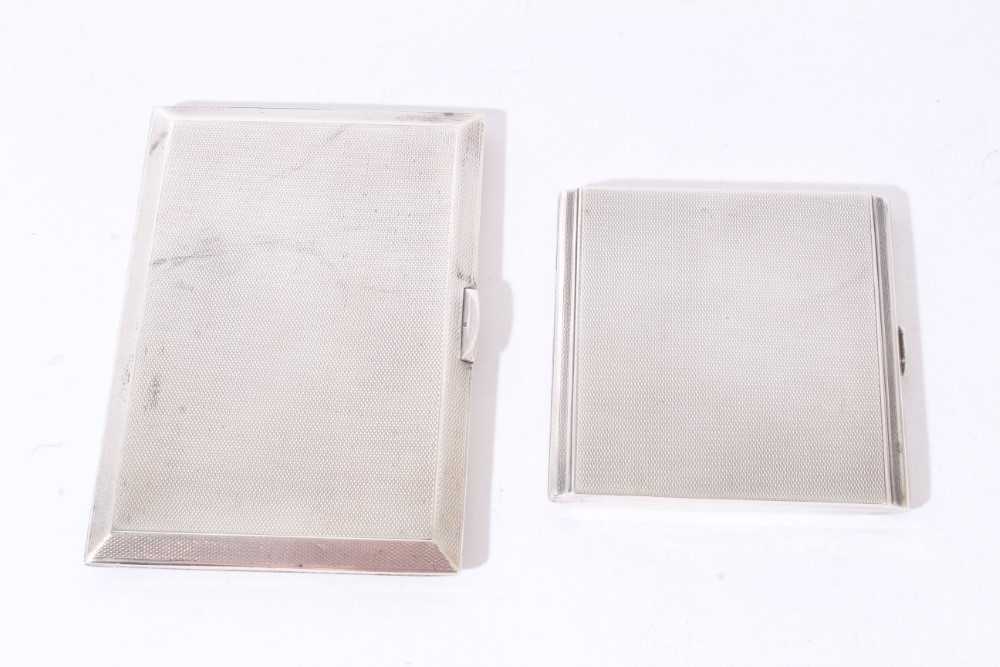 Lot 264 - Two 1930s silver engine turned cigarette cases, 10ozs