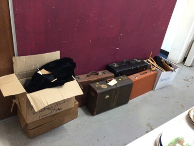 Lot 356 - Four old leather suitcases, together with two boxes of lace and linen, and vintage clothing