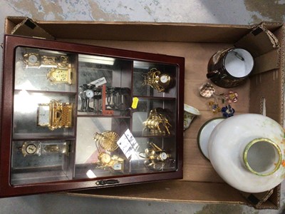 Lot 542 - Display cabinet with miniature clocks and sundries