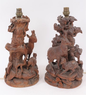 Lot 168 - Pair of late 19th / early 20th century Black Forest carved table lamps