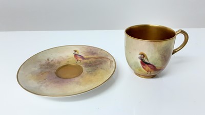 Lot 1246 - Royal Worcester cabinet cup and saucer, hand decorated with Pheasants, signed Jas Stinton