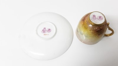 Lot 1246 - Royal Worcester cabinet cup and saucer, hand decorated with Pheasants, signed Jas Stinton