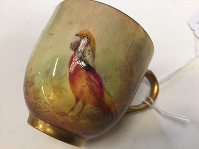 Lot 1246 - Royal Worcester cabinet cup and saucer, hand decorated with Pheasants, signed Jas Stinton