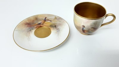 Lot 1247 - Royal Worcester cabinet cup and saucer, hand decorated with a Pheasant, signed Jas Stinton