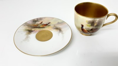 Lot 1248 - Royal Worcester cabinet cup and saucer, hand decorated with a Pheasant, signed Jas Stinton