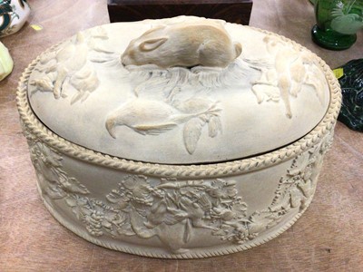 Lot 368 - Wedgwood caneware game pie dish, decorated in relief with age birds hanging from grape vines, the cover with a rabbit-form handle, complete with liner, 27cm across