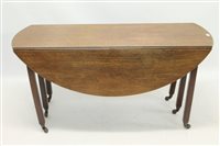 Lot 1521 - Oak drop-leaf dining table, the oval hinged...