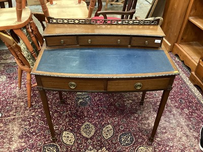 Lot 889 - Edwardian mahogany bowfront writing table with three upper drawers, two frieze drawers on taper legs 92 cm wide