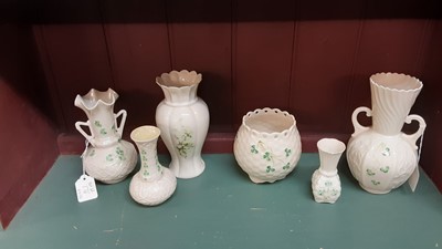 Lot 176 - Five Belleek vase with Shamrock decoration, and one other Belleek vase (6)