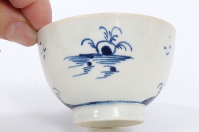 Lot 139 - 18th century Lowestoft porcelain blue and white tea bowl and saucer with painted temple and landscape, together with a similar bowl with transfer printed fence pattern