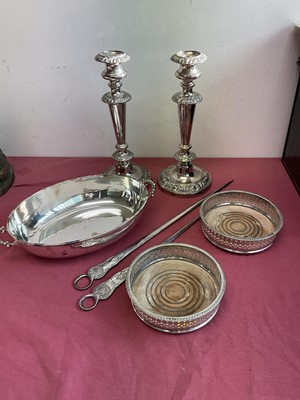 Lot 433 - Pair of silver plated candlesticks, pair coasters, two 19th century meat skewers and a plated dish