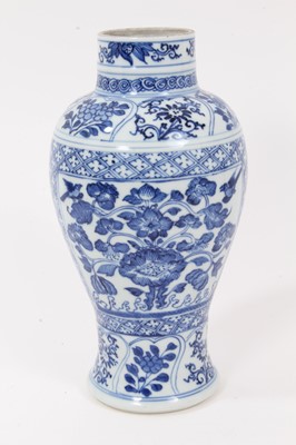 Lot 137 - 18th/19th century Chinese porcelain baluster form vase with painted underglaze blue floral panels