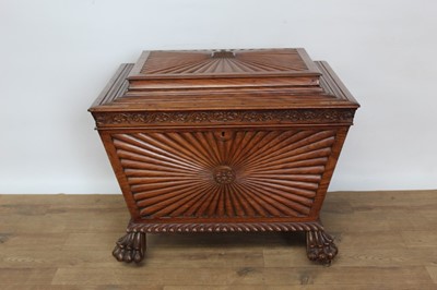 Lot 1431 - Regency Anglo-Indian hardwood cellarette of sarcophagus form, carved 
gadrooned borders, on paw feet and brass castors