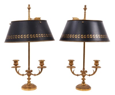 Lot 1370 - Pair of Regency-style gilt metal twin branch candlesticks with toleware shades