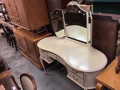 Lot 958 - French style cream and gilt dressing table with triple mirror back, five drawers below on cabriole legs, 131cm wide,140cm high