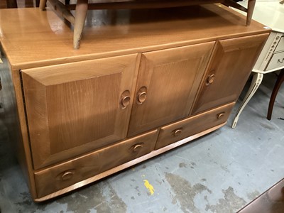 Lot 959 - Ercol sideboard with three cupboards and two drawers below, 129cm wide, 43cm deep, 76cm high