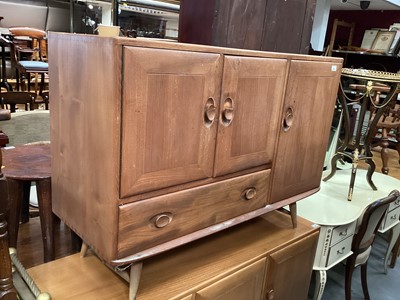 Lot 961 - Ercol sideboard with three cupboards and single drawer  (handles broken), 113cm wide, 42cm deep, 82cm high