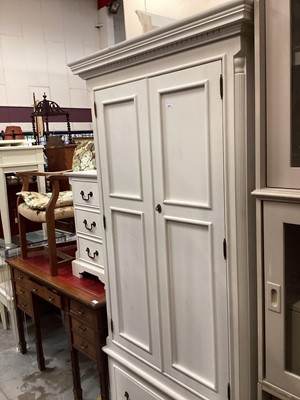 Lot 919 - Contempory white painted wardrobe with two panelled doors and drawer below, narrow chest of five drawers and another of three drawers and standard lamp base