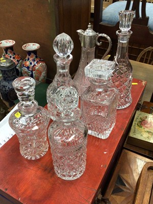 Lot 414 - Five glass decanters and claret jug