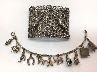 Lot 715 - Silver nurse's buckle (Chester 1897) and silver charm bracelet