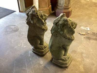 Lot 1035 - Pair of concrete garden lions, 55cm high