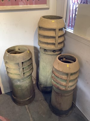 Lot 1030 - Three Victorian terracotta chimney pots, 110cm high, 79cm high and 77cm high