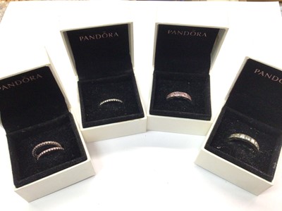 Lot 762 - Five Pandora silver (925) gem set dress rings, within four Pandora boxes