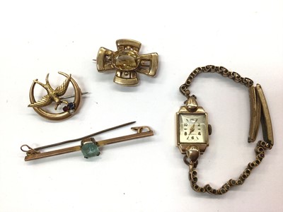 Lot 764 - 9ct gold cased wristwatch and three gold brooches