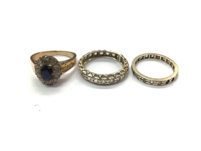 Lot 765 - 9ct gold sapphire and diamond cluster ring and two other eternity rings