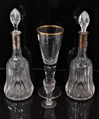 Lot 1256 - Pair of cut glass decanters with German silver mounts, together with two other glasses