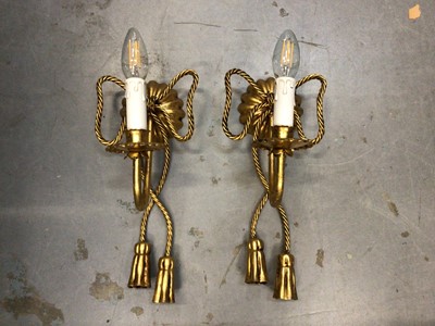 Lot 628 - Pair of gilt tasselled rope style electric twin branch wall sconces, with candle bulb fittings