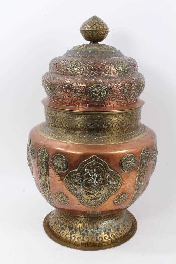 Lot 886 - Large antique Tibetan brass and copper vessel