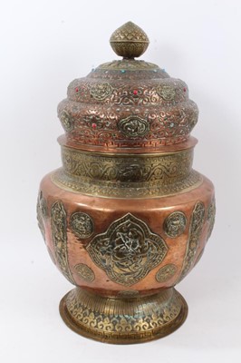 Lot 810 - Large antique Tibetan brass and copper vessel