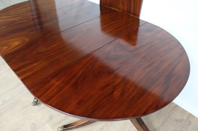 Lot 89 - Regency style mahogany twin pillar dining table